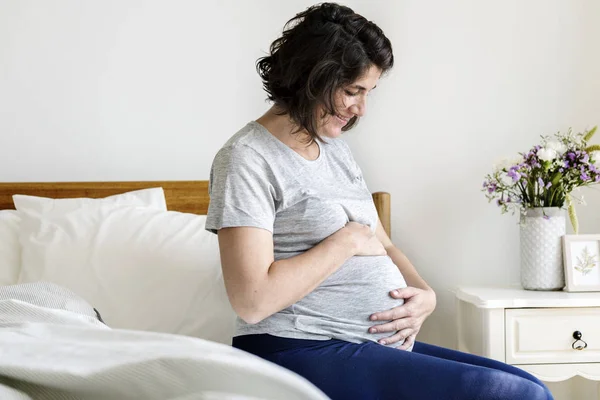 Pregnant Woman Sitting Bed Touching Belly — Stock Photo, Image