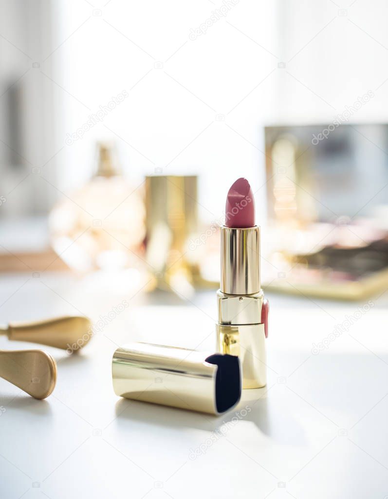 Closeup of lipstick on white table