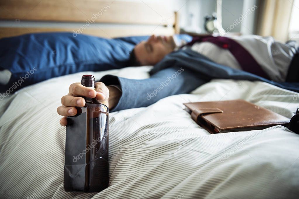  drunk man lying in bed