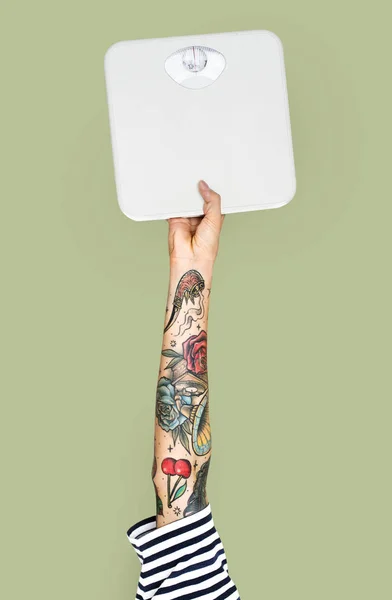 Human Hand Tattoos Green Background Holding Weighing Scales — Stock Photo, Image