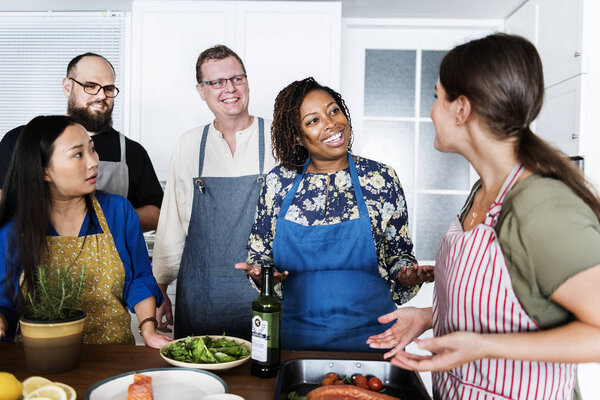 Diverse people joining cooking class