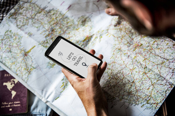 Man planning trip with map
