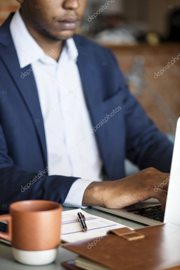 african businessman using computer laptop