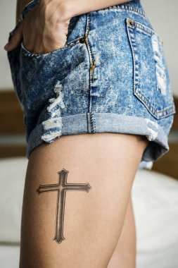 Closeup of a upper thigh tattoo of a woman clipart