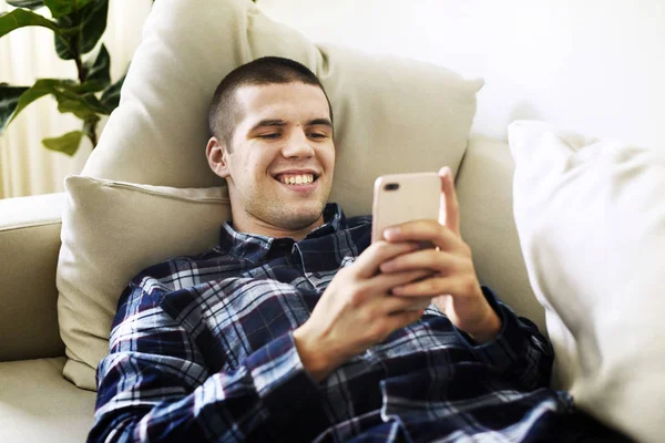 Smiling Man Using Smartphone Home — Stock Photo, Image