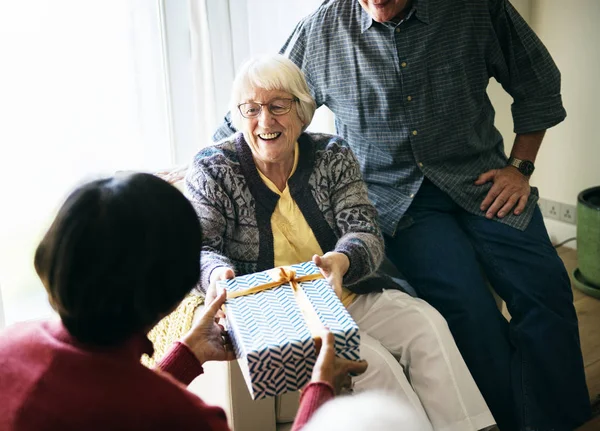 Cheerful Senior Woman Receiving Gift Box — Stock Photo, Image