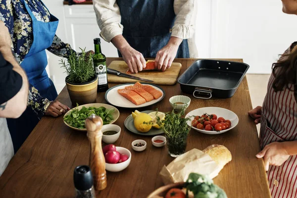 Diverse people joining cooking class;