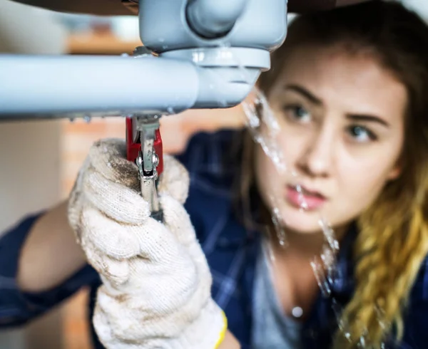 Woman Fixing Kitchen Sink — Stock Photo, Image