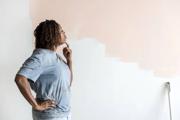 Woman thinking about renovating the house