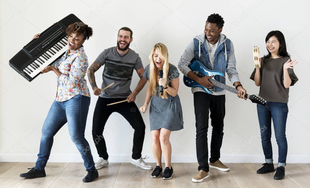 happy musical band playing song and dancing in room 