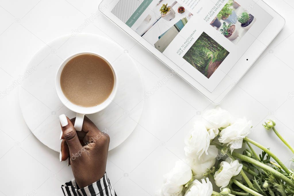 Aerial view of black woman drinks coffee