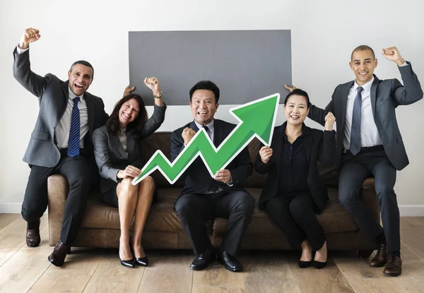 Business People Suits Holding Green Profit Arrow Sitting Sofa — Stock Photo, Image