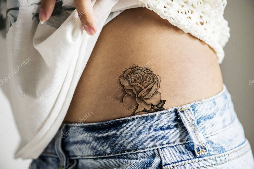 Closeup of lower hip tattoo of a woman