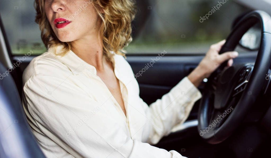 Woman driving a car in reverse 