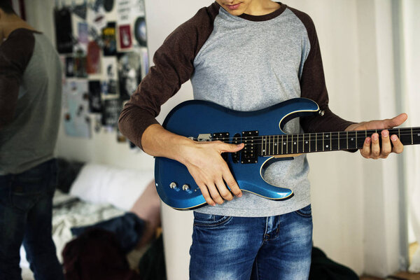 Teenage Boy Playing Electric Guitar Bedroom Hobby Music Concept Royalty Free Stock Photos