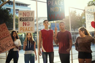 Group of teenagers protesting demonstration holding posters antiwar justice peace concept clipart