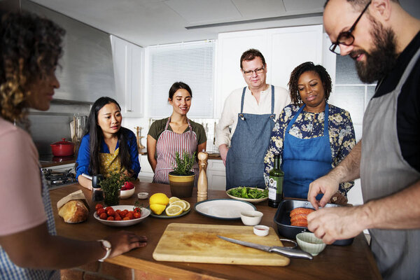 Diverse people joining cooking class
