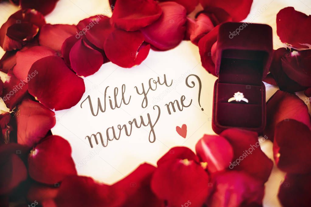 Marriage proposal in rose petals