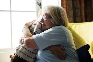 Grandma and grandson hugging together clipart