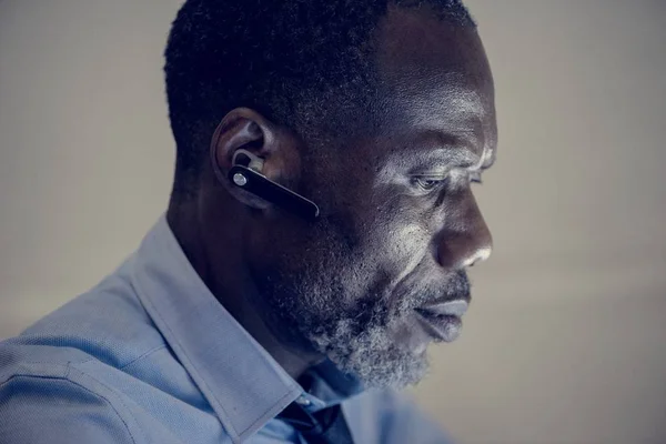 side view of african american businessman with headset