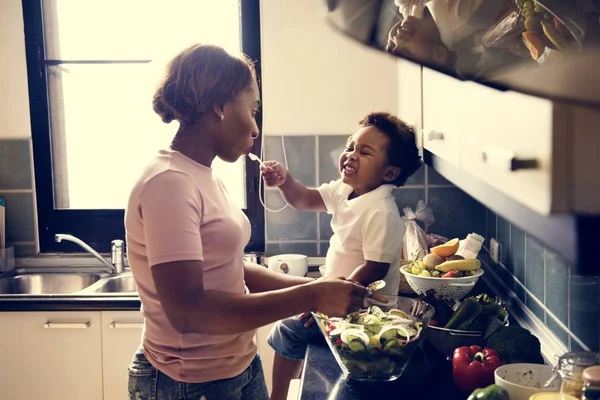 Kid Feeding Mom Kitchen — Stock Photo, Image