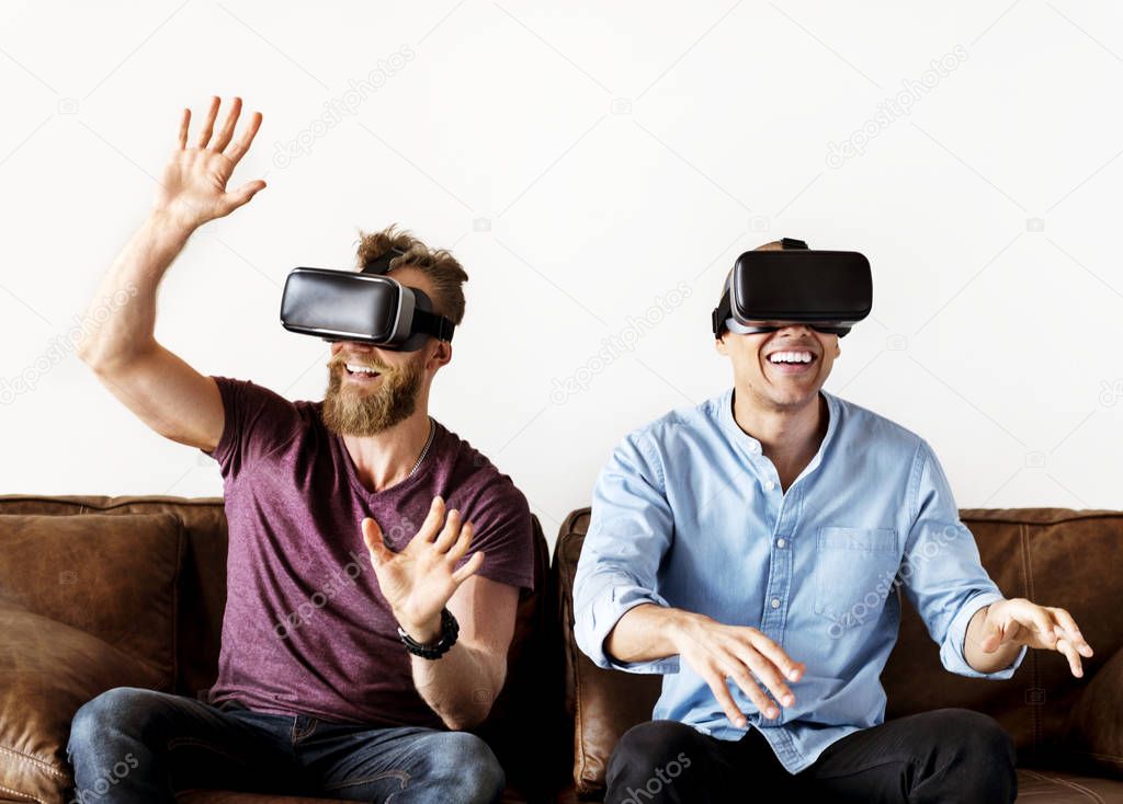 Men enjoying VR glasses