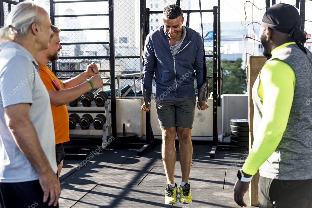 People exercising at fitness gym