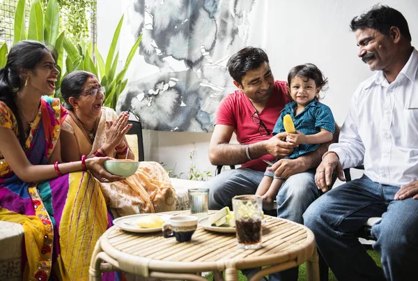 A happy Indian family eating together