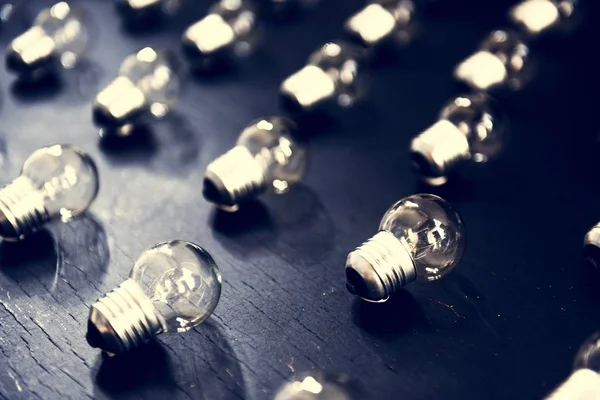 Lightbulbs Black Textured Table — Stock Photo, Image