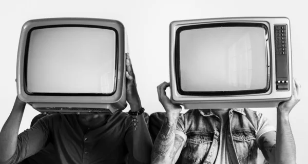 People Holding Retro Television Next Each Other — Stock Photo, Image