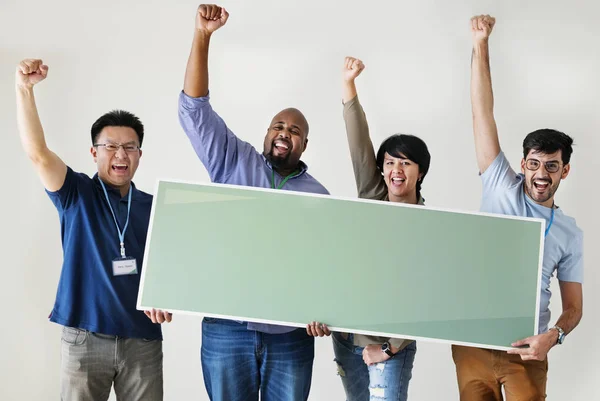 Diverse workers holding empty banner for copy space