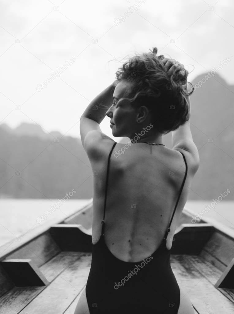 Beautiful woman posing on a boat