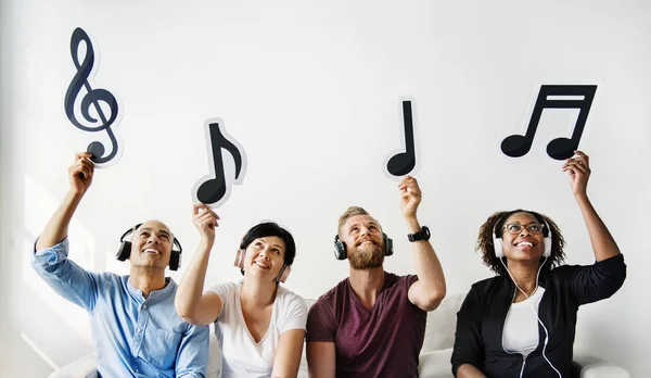 People Holding Musical Icons — Stock Photo, Image