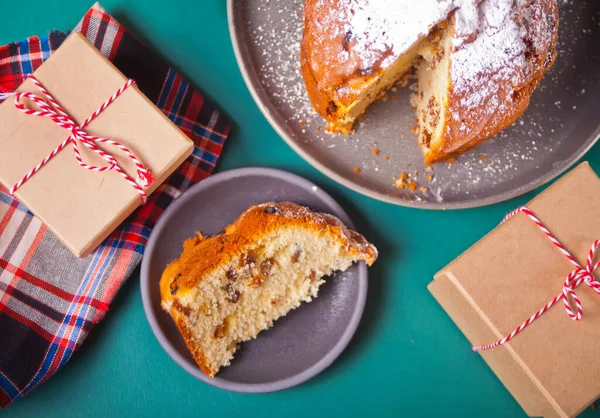 Traditional Christmas cake panettone with fruits and nuts with Christmas decoration — Stock Photo, Image