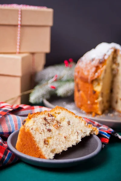 Traditional Christmas cake panettone with fruits and nuts with Christmas decoration — Stock Photo, Image