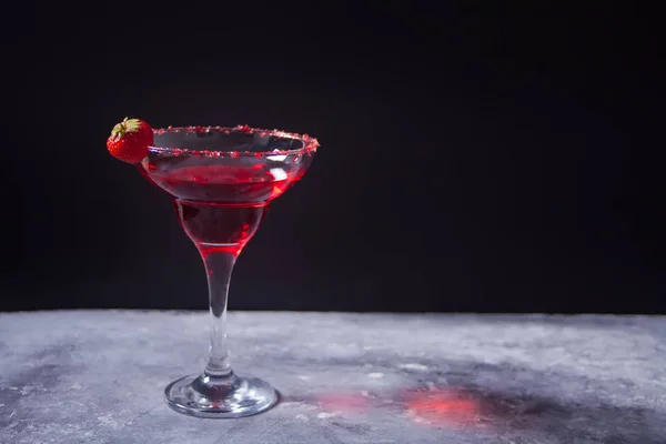 Red exotic alcoholic cocktail in clear glass on the concrete background for romantic dinner. — 스톡 사진