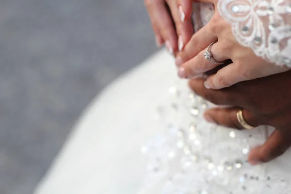 Hands with wedding rings