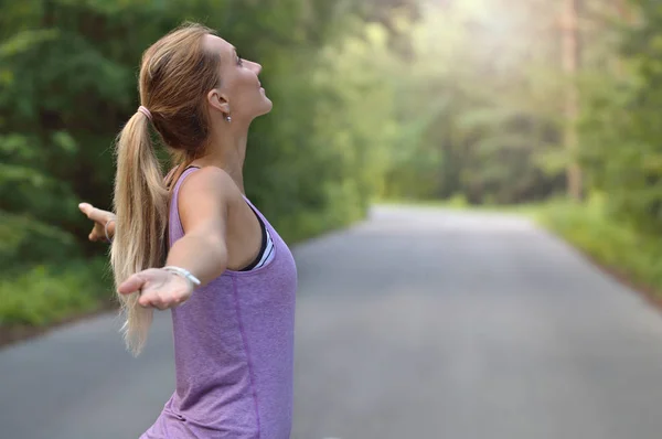 Joyful woman breathing fresh air outdoors — Stock Photo, Image