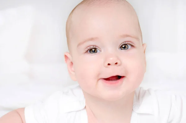 Happy smiling child with wide open brown eyes — Stock Photo, Image