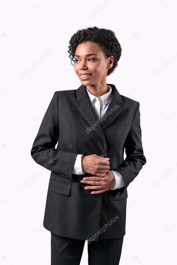 Businesswoman isolated on white background. Young smiling african business woman standing formal suit.