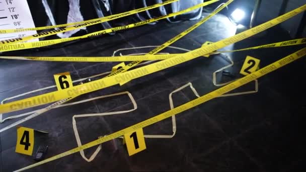 The yellow ribbon caution crime scene murder silhouette evidence haloween — Stock Video