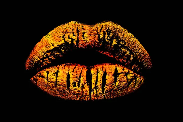 Golden lips isolated on black background. Print or trace from the lips, sensual royal kiss, female mouth in Egypt style. Cosmetics concept, creative chic and luxury makeup. Gold fashion lipstick trend — Stock Photo, Image
