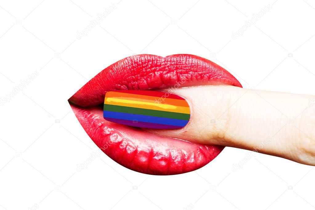 Manicure colors rainbow flag of LGBT. Nail near the female mouth. Lips with lipstick of young girl, style of make-up and manicure. Female sexy mouth with finger isolated on white background