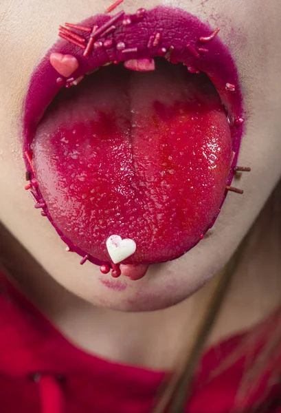 Tongue for dessert, sexy St. Valentine\'s Day, sweet blowjob. Decorations for cake or for body. Red female mouth with tongue for Easter. Delicious kiss and sensual girl, cooking heart food to eat
