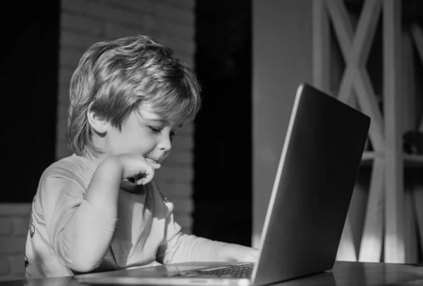 Distance learning. Online quarantined games. Childrens life online. Boy with laptop. Blogger.