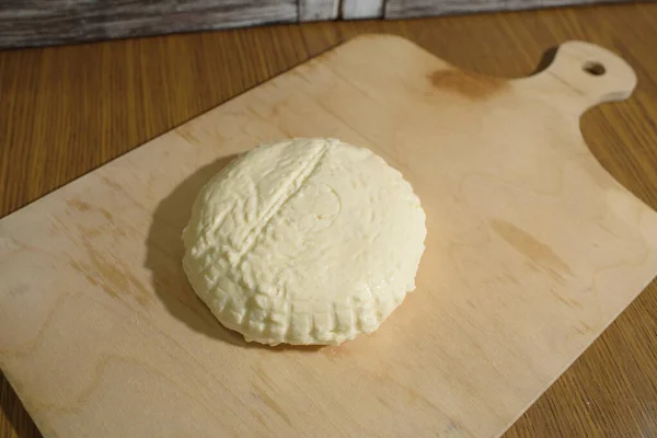 Fresh Adyghe cheese on a wooden tray on a wooden background — Stock Image Fresh Adyghe Cheese Wooden Tray Wooden Background Stock Image