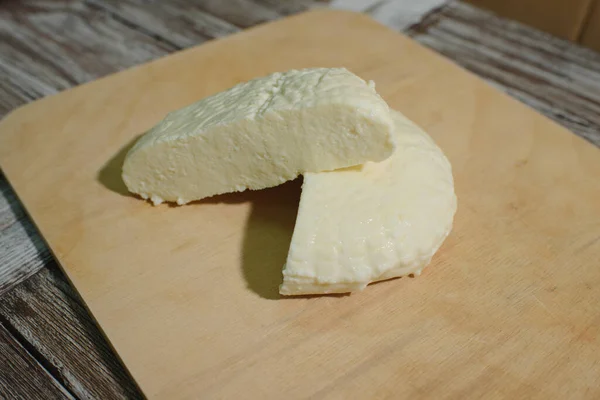 Fresh Adyghe cheese on a wooden tray on a wooden background — Stock Image Fresh Adyghe Cheese Wooden Tray Wooden Background Stock Picture