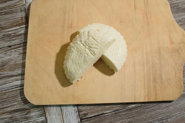 Fresh Adyghe cheese on a wooden tray on a wooden background — Stock Image Fresh Adyghe Cheese Wooden Tray Wooden Background Royalty Free Stock Images