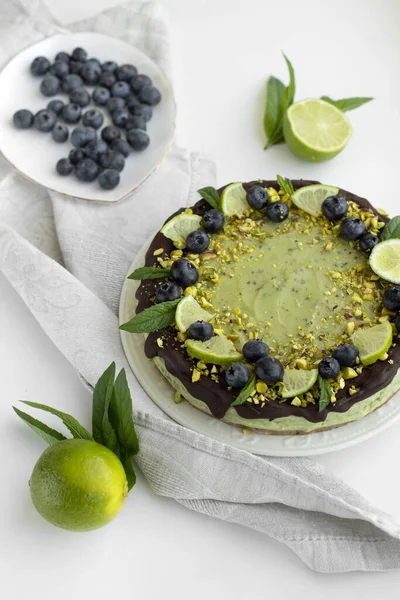 Raw healthy avocado lime cake with blueberries. Gluten free and sugar free