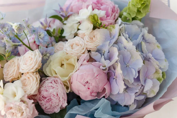 Beautiful soft tone flower bouquet. Pastel flower background. Roses, peony,hydrangea.Flower shop. Flower wallpaper.